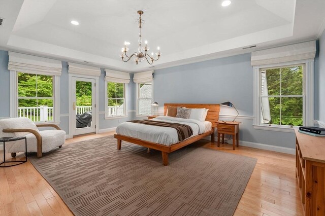 51 Summer St, Weston, MA 02493 - bedroom featuring a raised ceiling, access to outside, a chandelier, light wood-type flooring, and recessed lighting