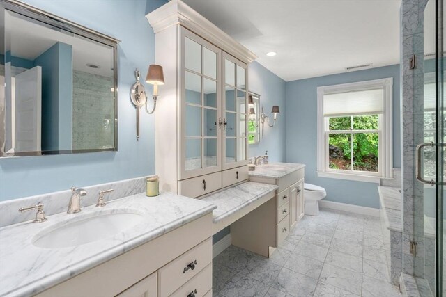 51 Summer St, Weston, MA 02493 - bathroom featuring vanity, baseboards, a shower stall, marble look tiles, and toilet