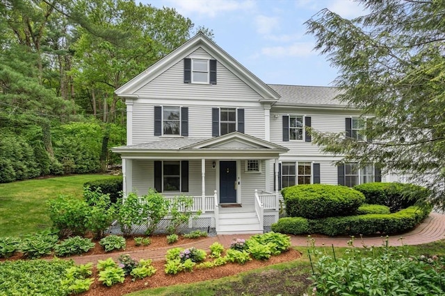 51 Summer St, Weston, MA 02493 - greek revival inspired property with a porch, a front yard, and roof with shingles