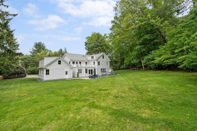 51 Summer St, Weston, MA 02493 - back of property with a lawn and a patio area