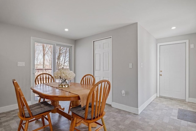 dining room with recessed lighting, baseboards, and light floors