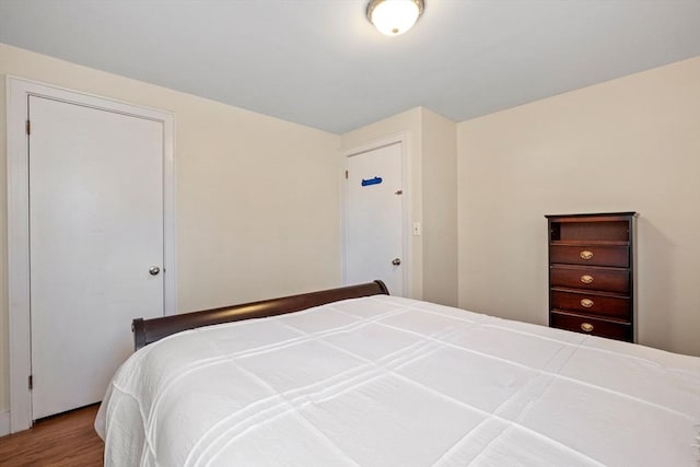 bedroom with wood finished floors