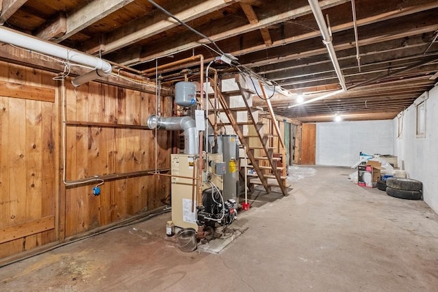 unfinished below grade area featuring electric water heater
