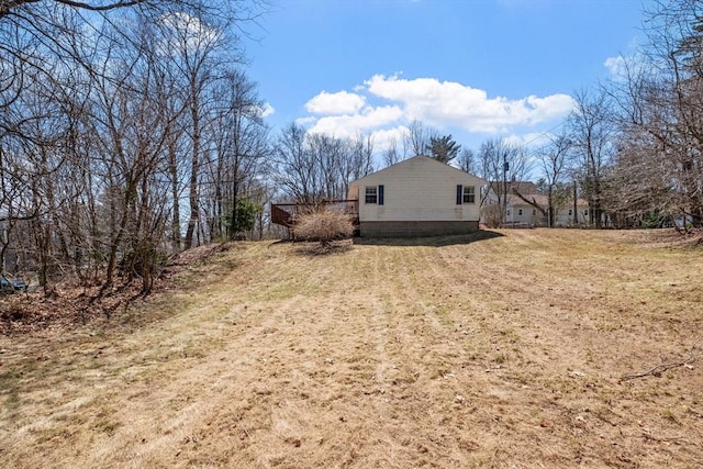 view of home's exterior with a yard