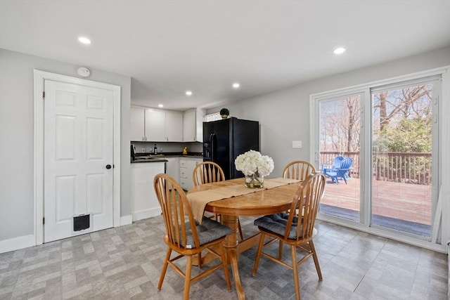 dining area featuring baseboards and recessed lighting