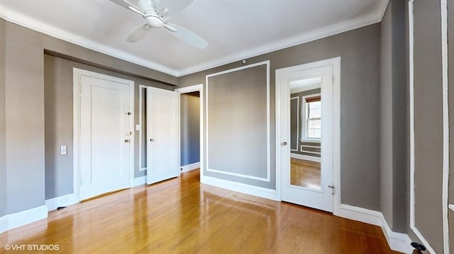 unfurnished bedroom with hardwood / wood-style flooring and ceiling fan