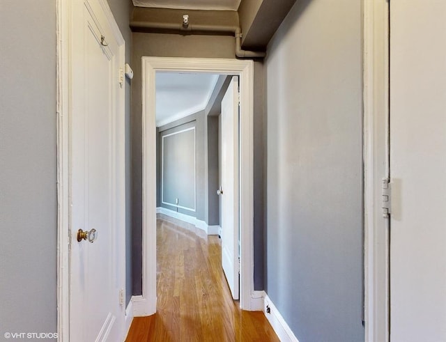 hall with light hardwood / wood-style flooring