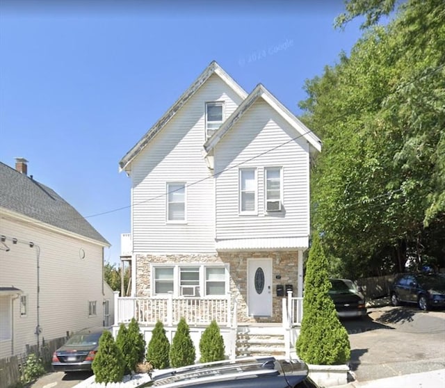 14 Russell St, Everett, MA 02149 - view of front of home featuring stone siding and a porch