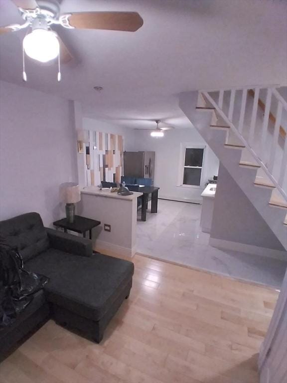14 Russell St, Everett, MA 02149 - living area with ceiling fan, stairs, and light wood-type flooring