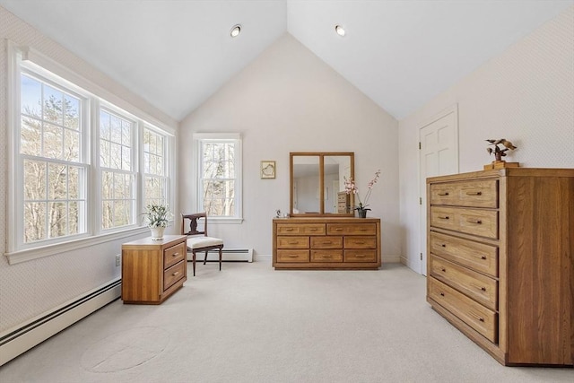 living area with light colored carpet, baseboard heating, and high vaulted ceiling