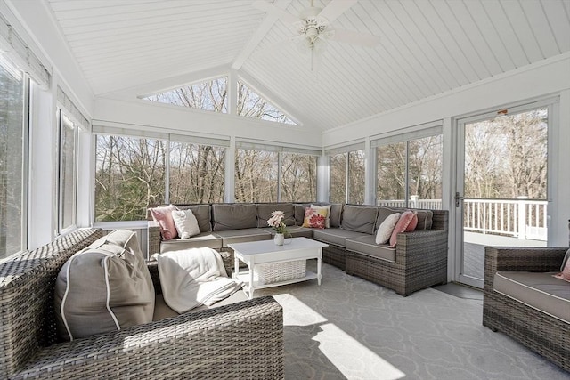 sunroom / solarium with vaulted ceiling and a ceiling fan