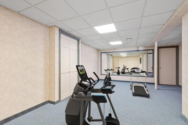 workout room with carpet, a paneled ceiling, visible vents, and baseboards