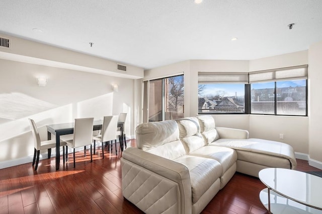 living room featuring dark hardwood / wood-style floors