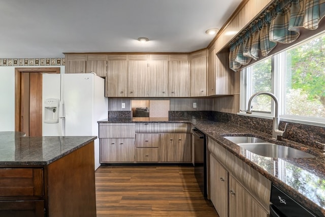 kitchen with sink, dishwasher, white refrigerator with ice dispenser, dark hardwood / wood-style flooring, and dark stone countertops