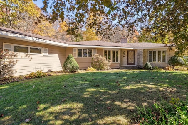 single story home with a front yard