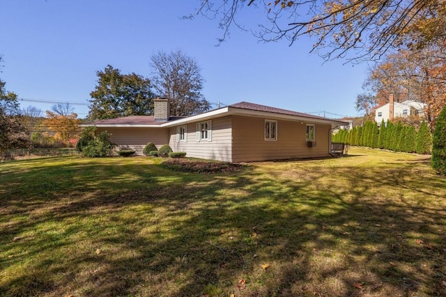 view of home's exterior with a lawn