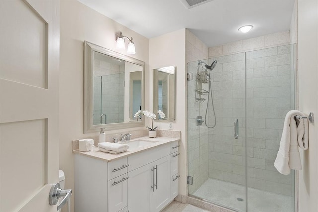 full bath featuring a shower stall and vanity