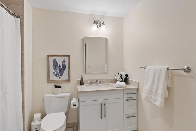 bathroom featuring curtained shower, toilet, and vanity