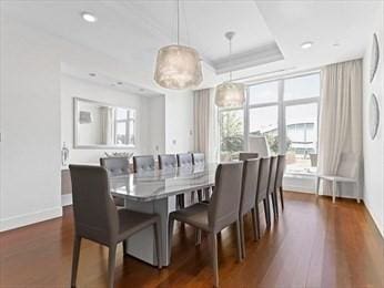 dining space with dark wood-type flooring, plenty of natural light, and recessed lighting