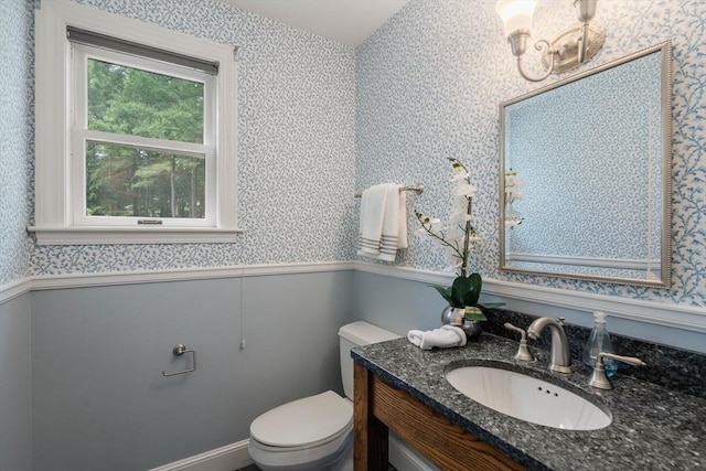8 Pleasant St, Dover, MA 02030 - half bathroom featuring wallpapered walls, wainscoting, vanity, and toilet
