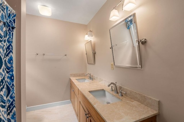 8 Pleasant St, Dover, MA 02030 - bathroom featuring double vanity and baseboards