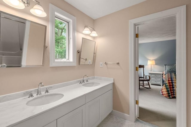 8 Pleasant St, Dover, MA 02030 - bathroom featuring double vanity, marble look tile flooring, and baseboards