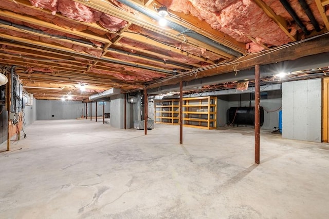 8 Pleasant St, Dover, MA 02030 - unfinished below grade area with oil tank and heating unit