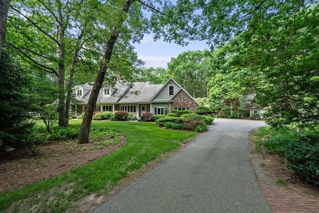 8 Pleasant St, Dover, MA 02030 - view of front of home with a front yard and brick siding