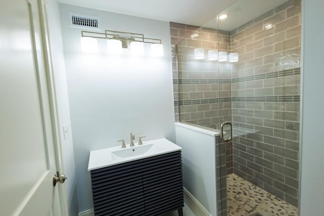 bathroom featuring a stall shower, recessed lighting, visible vents, and vanity
