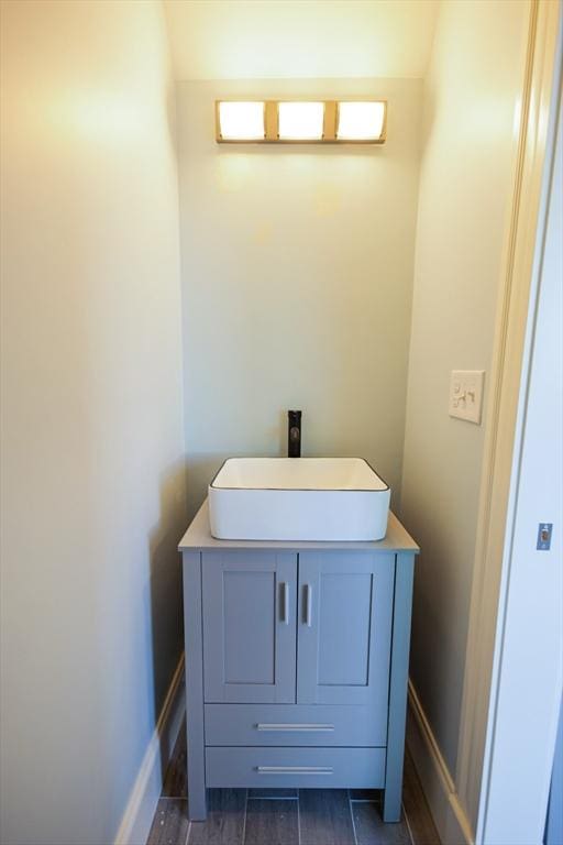bathroom with vanity and baseboards