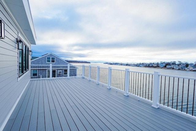 wooden terrace with a water view