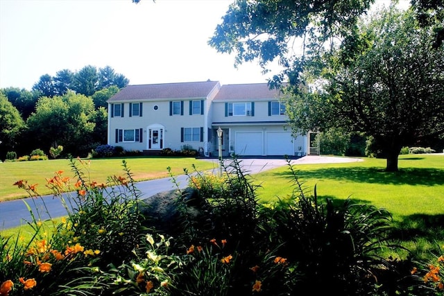 view of front of house featuring a garage and a front yard