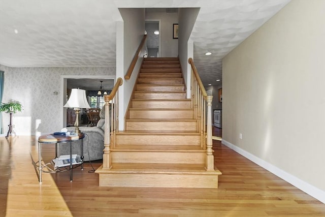 stairs with wood-type flooring