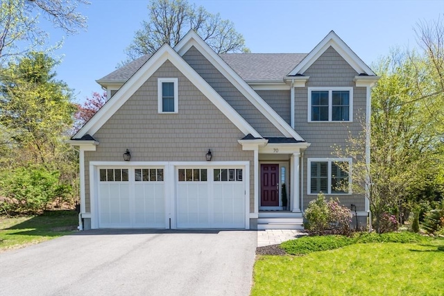 70 Rockland St, Natick, MA 01760 - craftsman inspired home featuring a front lawn, roof with shingles, and aphalt driveway