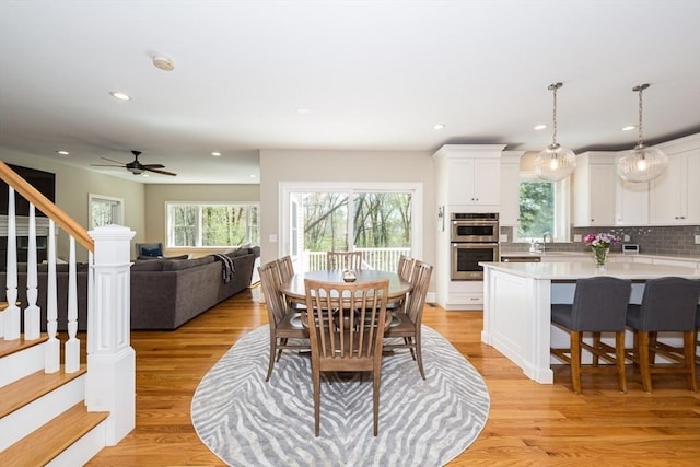 70 Rockland St, Natick, MA 01760 - dining area featuring light wood-type flooring, recessed lighting, ceiling fan, and stairway