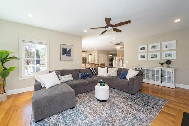 70 Rockland St, Natick, MA 01760 - living room with a ceiling fan, baseboards, light wood-style flooring, and stairway