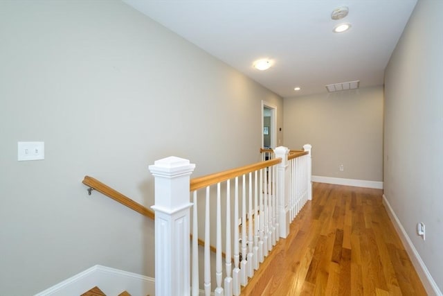 70 Rockland St, Natick, MA 01760 - hallway featuring baseboards, an upstairs landing, and light wood-type flooring