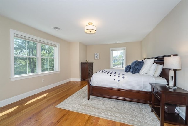 70 Rockland St, Natick, MA 01760 - bedroom featuring baseboards, visible vents, and light wood finished floors