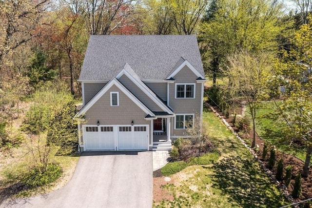 70 Rockland St, Natick, MA 01760 - view of front of house featuring a shingled roof and driveway