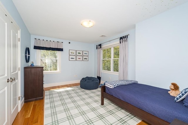 70 Rockland St, Natick, MA 01760 - bedroom with baseboards and light wood-style floors