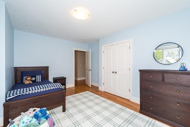 70 Rockland St, Natick, MA 01760 - bedroom with baseboards, a closet, and wood finished floors