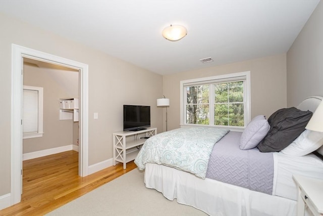 70 Rockland St, Natick, MA 01760 - bedroom featuring baseboards, light wood-type flooring, and visible vents