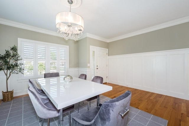 70 Rockland St, Natick, MA 01760 - dining room featuring crown molding, a decorative wall, a chandelier, and wood finished floors
