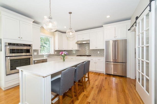 70 Rockland St, Natick, MA 01760 - kitchen featuring tasteful backsplash, stainless steel appliances, recessed lighting, and white cabinets