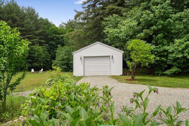 detached garage with gravel driveway