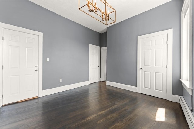 17 Savin Hill Ave Unit 3, Boston, MA 02125 - unfurnished dining area featuring baseboard heating, a chandelier, and dark wood-style flooring