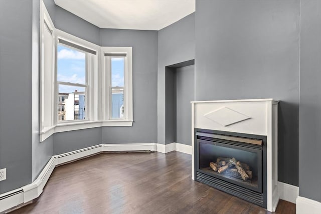 17 Savin Hill Ave Unit 3, Boston, MA 02125 - unfurnished living room featuring a glass covered fireplace and dark wood-style flooring