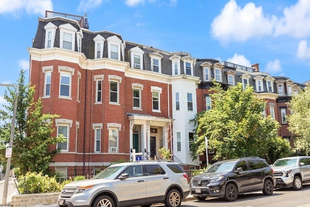17 Savin Hill Ave Unit 3, Boston, MA 02125 - view of front of house with brick siding, mansard roof, and a residential view