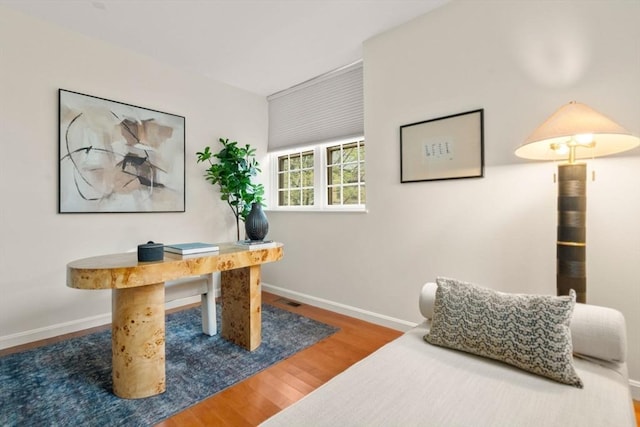 office featuring wood finished floors and baseboards