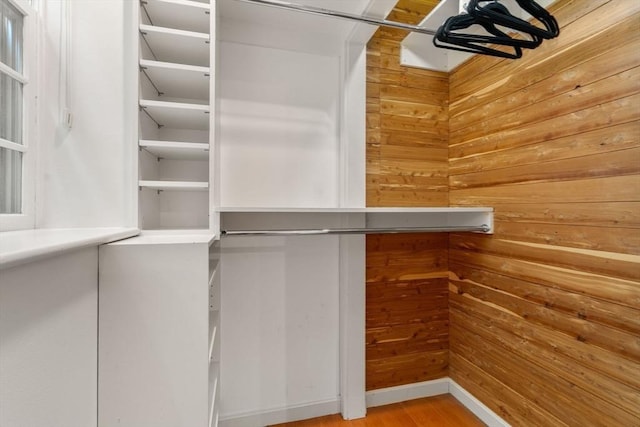 spacious closet featuring wood finished floors